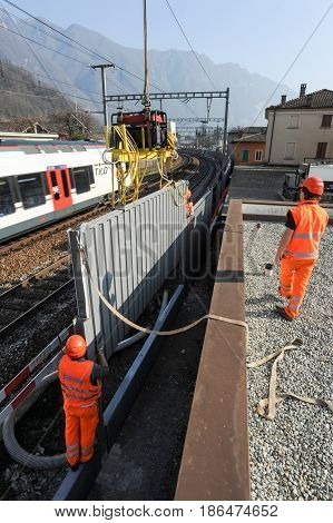 Workers During The Installation Of Noise Barriers On The Railway
