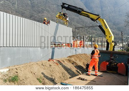 Workers During The Installation Of Noise Barriers On The Railway