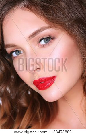 Beautiful woman skin with red lips on white background