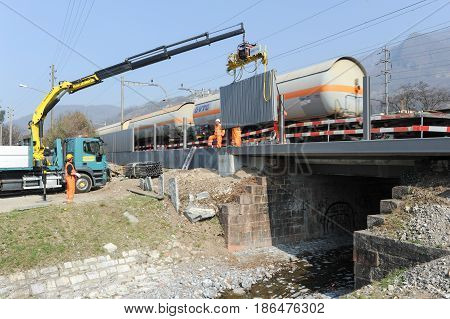 Workers During The Installation Of Noise Barriers On The Railway