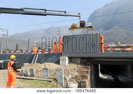 Workers During The Installation Of Noise Barriers On The Railway