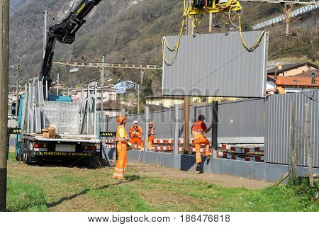 Workers During The Installation Of Noise Barriers On The Railway