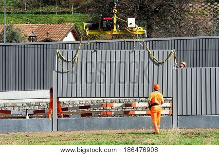 Workers During The Installation Of Noise Barriers On The Railway