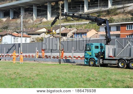 Workers During The Installation Of Noise Barriers On The Railway