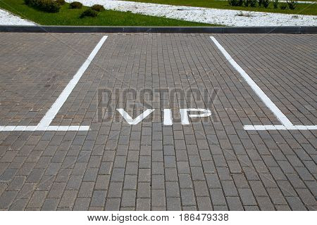 Empty parking space for a car with the word VIP