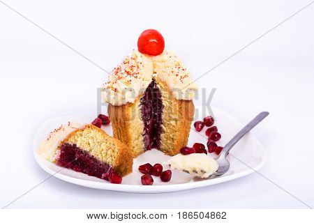 Pomegranate sweet cupcake isolated on white background.