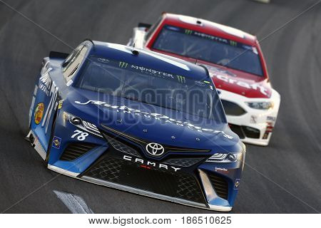 May 13, 2017 - Kansas City, Kansas, USA: Martin Truex Jr. (78) brings his car through the turn during the Go Bowling 400 at Kansas Speedway.