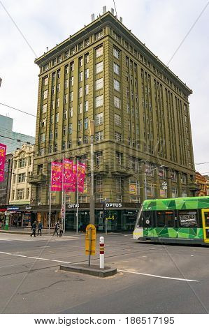 Historic London Stores Building And Tram Crossing The Road