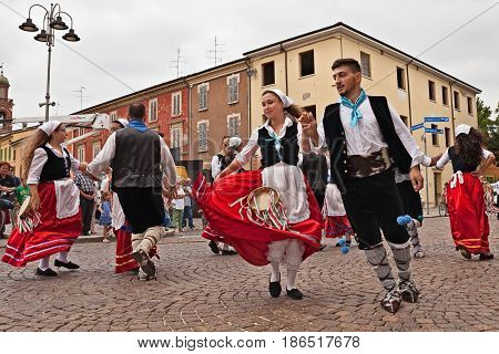 RUSSI, RA, ITALY - AUGUST 2: the folk dance ensemble Irizema from Bova Marina, Calabria, Italy performs traditional dance tarantella in the town square during the International Folklore Festival on August 2, 2015 in Russi, Ravenna, Italy
