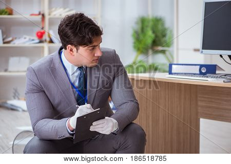 Young man during crime investigation in office