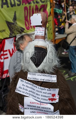 BERLIN - MAY 01 2016: An activist in the neck suit. Members of trade unions workers and employees at the demonstration on the occasion of Labour day.