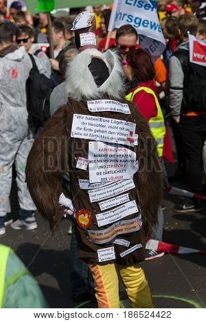 BERLIN - MAY 01 2016: An activist in the neck suit. Members of trade unions workers and employees at the demonstration on the occasion of Labour day.