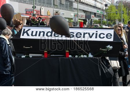 BERLIN - MAY 01 2016: The funeral of customer service. Members of trade unions workers and employees at the demonstration on the occasion of Labour day.