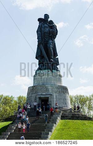 BERLIN - MAY 08 2016: Victory in Europe Day. Treptower Park. Soviet War Memorial (Monument to the Liberator Soldier) and numerous guests and visitors.