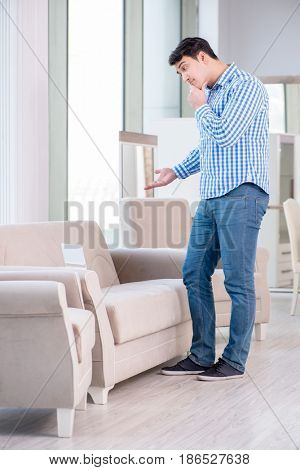 Young man shopping in furniture store