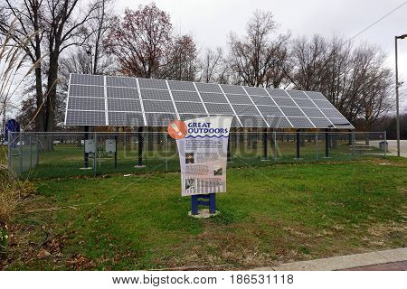 NEW BUFFALO, MICHIGAN / UNITED STATES - NOVEMBER 20, 2016: A sign extols recreational opportunities in the state of Michigan, in front of solar panels at the New Buffalo Welcome Center 707.