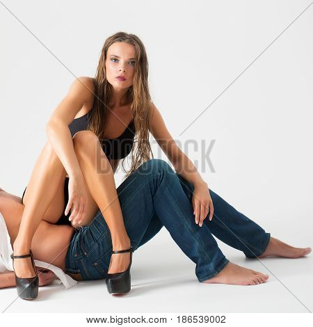 Girl In Black Bra Sitting On Naked Male Belly