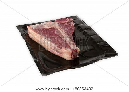 TBone steak in vacuum package isolated on white background