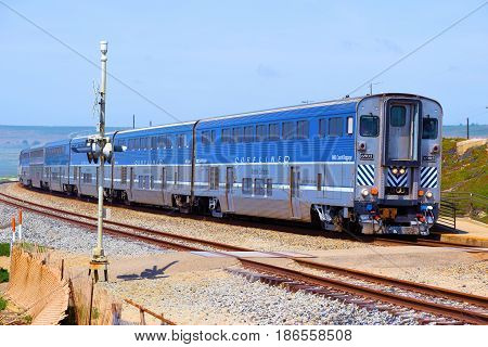 April 29, 2017 in Surf, CA:  Amtrak Surfliner passenger train where passengers can travel to towns on the California Coast and which this train is currently traveling southbound following the scenic California Coast taken in Surf, CA