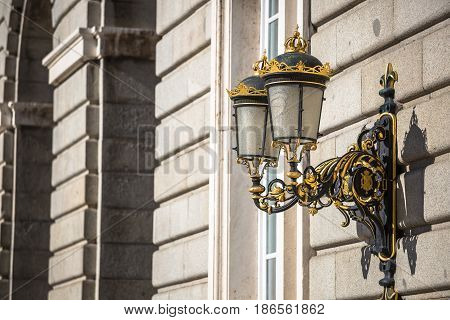Elegant city lantern near royal palace in Madrid