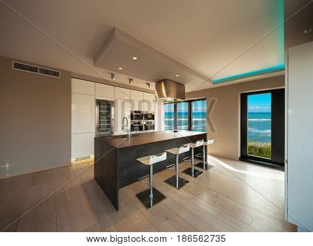Interiors of a modern apartment, without furniture, sea view