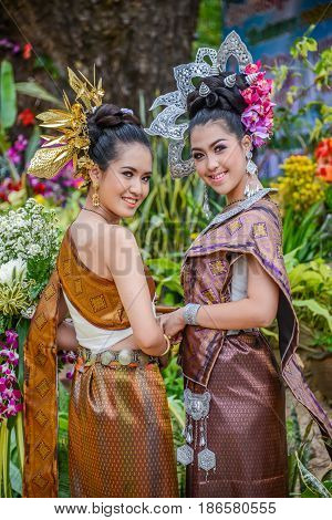 NAKORN PHANOM THAILAND - FEBRUARY 14 2015: Thai northeastern Phutai dancers with traditional costume in Phutai world event day in Renunakorn of Nakorn Phanom Thailand.