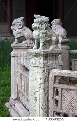 Shenyang, China - July 20, 2013: Cracked sculptures of mythical animals in Beiling Park, not far from Zhaoling Tomb of the Qing Dynasty