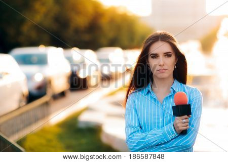 Female News Reporter on Field in Traffic