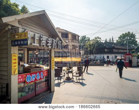 Shanghai, China - Nov 4, 2016: Near Fuyou Road - There are many small shops. The one in the foreground sells Shanghai Old Yogurt, tea and other snacks.