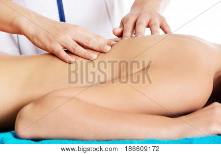 Woman having massage of body in the spa salon. Beauty treatment concept.