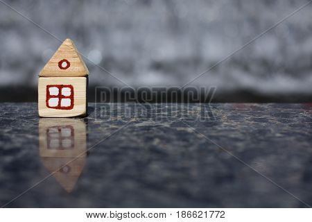Small layout wooden house on a solid granite surface / solid foundation for living