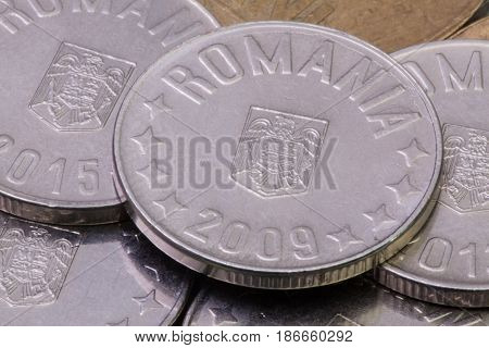 Detail of different Romania Leu coins on the table.