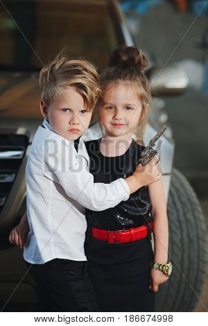 photo of young boy and girl playing spy