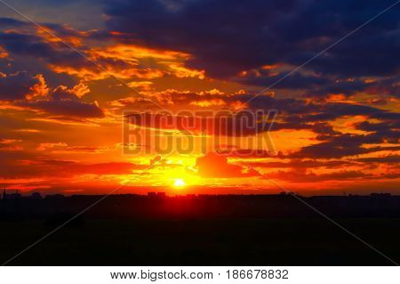 Beautiful summer sunset over a provincial town. Shooting from out of town