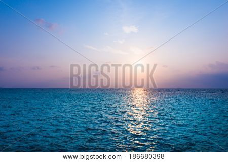 Colorful sunset over the Indian Ocean. Maledives.