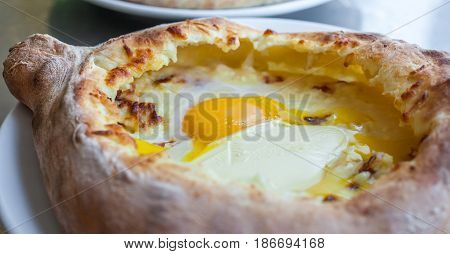 Adjarian Khachapuri With Eggs On The Table