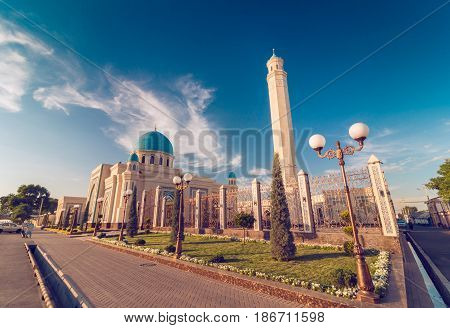 Beautiful Mosque (Islamic temple) at sunset over blue sky wide angle photo