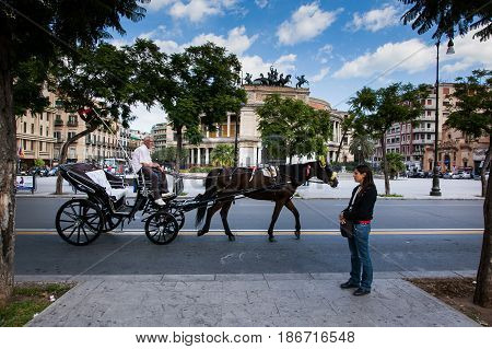 Palermo, Italy - October 14, 2009: Horse Cart In Background The Politeama Garibaldi Theater