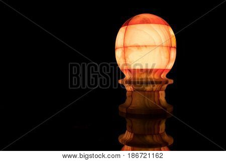 A Glowing Marble Lamp in Dark Background