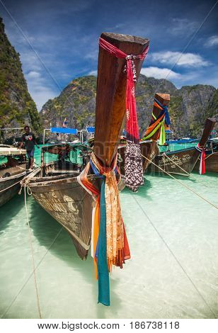 KO PHI PHI LEH, THAILAND, February 1, 2014: Traditional long tail boats on the beach of Maya Bay, Andaman Sea, famous tourist destination in the Ko Phi Phi achipelago