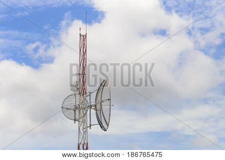 Telecommunication or Antenna tower building with the blue sky.The telecommunication concept.