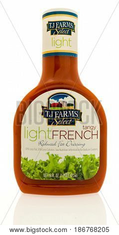 Winneconne WI - 15 May 2017: A bottle TJ Farms light French salad dressing on an isolated background.
