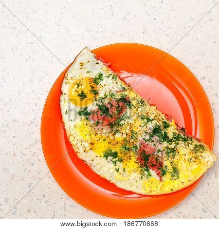 Scrambled eggs with ham and herbs. Delicious and nutritious breakfast.