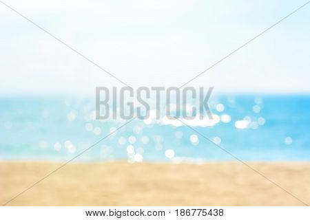 Blur summer white sand beach with sparkling sea water