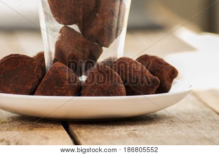chocolate truffle close up on wooden table