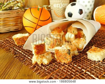 Crispy snacks in a paper bag for a picnic and watching sports matches