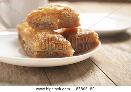 baklava close up on white plate in white background
