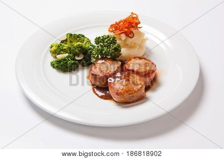 Pork Medallions Wrapped In Bacon, With Potatoes And Broccoli