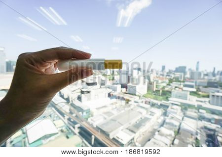 close up woman left hand with lip balm for beauty