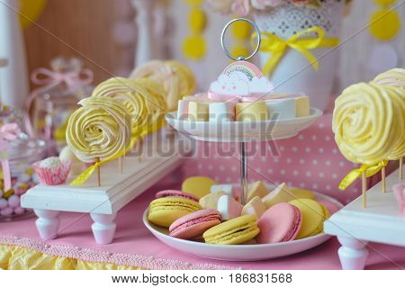 candy bar for first year birthday, candies , cakes on the table